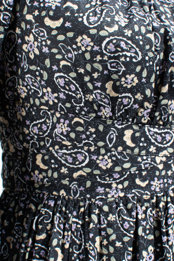 french style feminine dress - a puff sleeve square neckline full skirt floral dress. dark floral pattern. up close floral pattern view. 