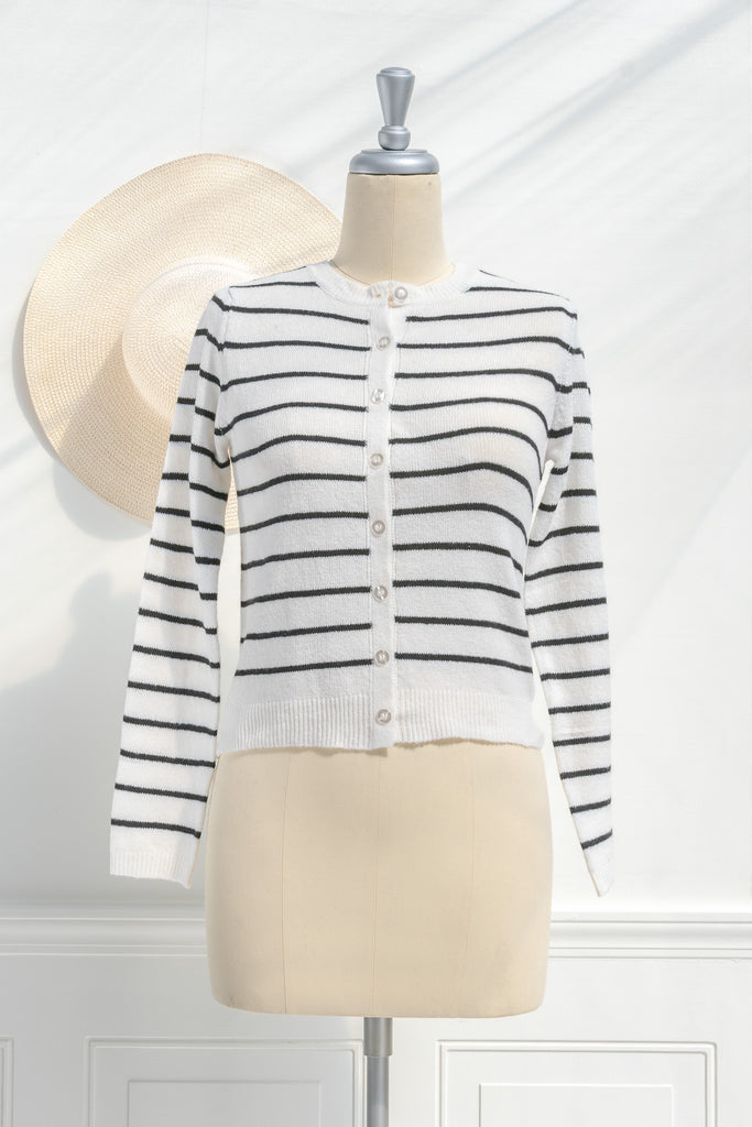 breton striped shirt - a classic light weight cardigan with black stripes against black stripes. button down long sleeve, crew neck. french girl style. front view. amantine. 