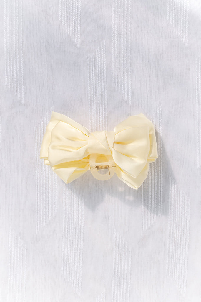 gifts for francophiles. french hair accessories - a 4 inch cream satin bow with claw clip. feminine french style. 