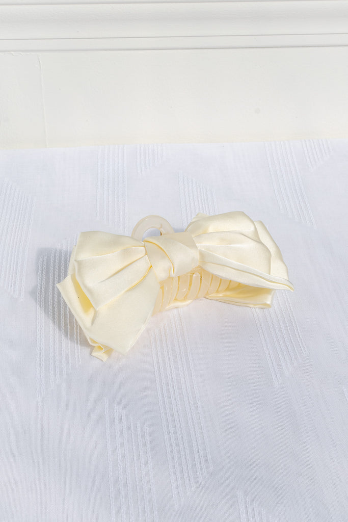 french hair accessories - a 4 inch yellow satin bow with claw clip. feminine french style. 