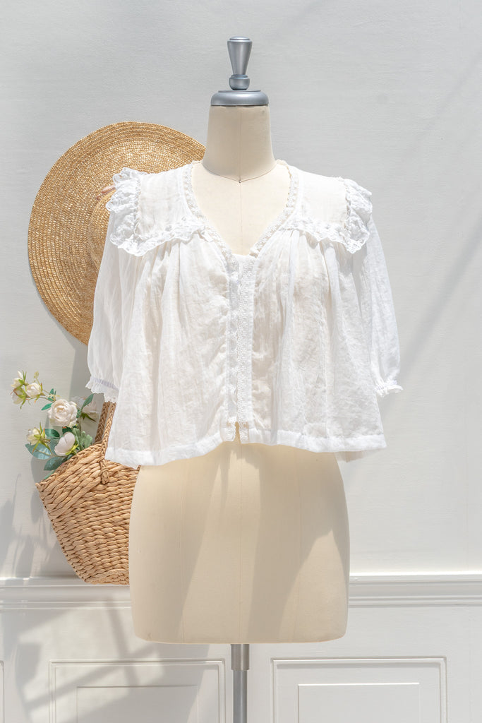 White lace blouse on a mannequin. Essential french girl style white blouse. for summer. 