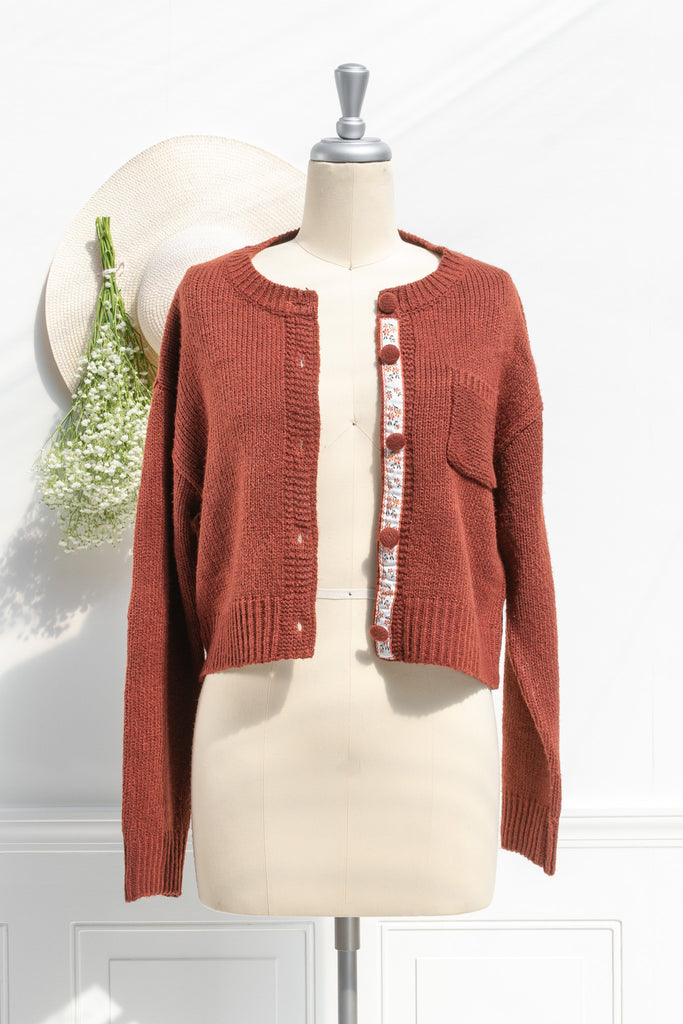 french tops. feminine cottagecore style. a cute rust color button down cardigan. front view. amantine. 