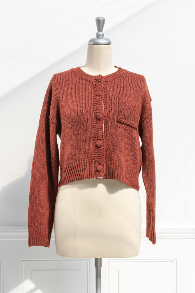 french tops. feminine cottagecore style. a cute rust color button down cardigan. front view. amantine. 