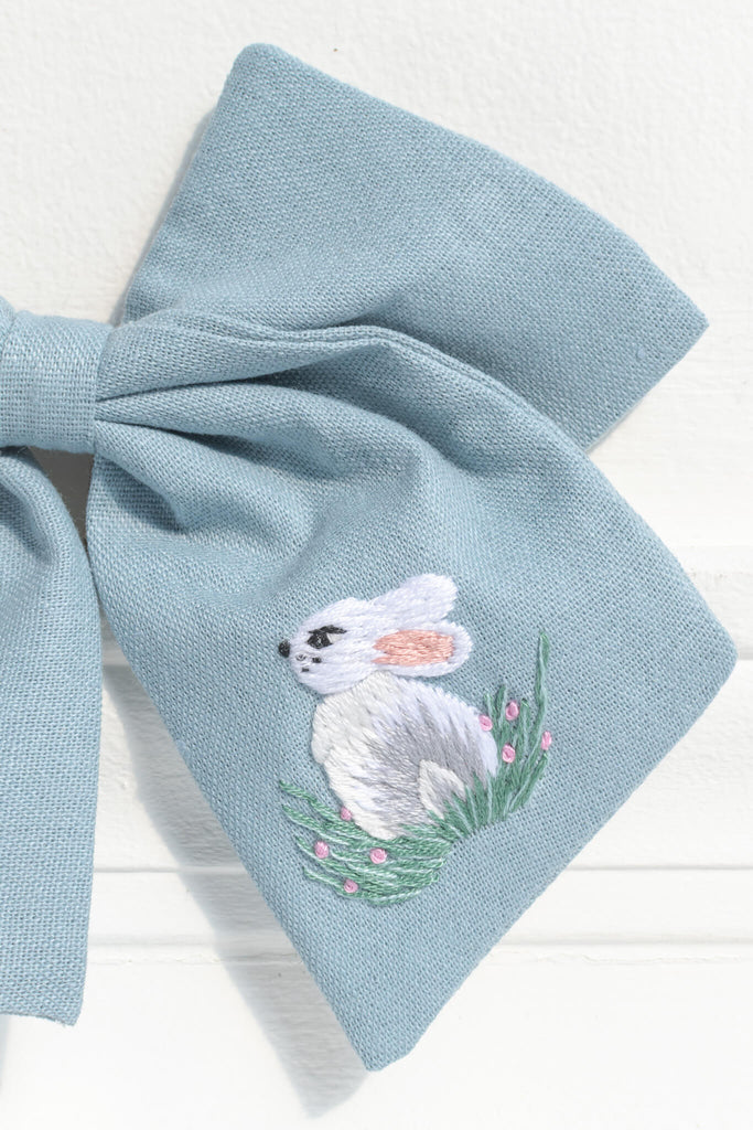 french girl hair accessories. a blue clip bow with a pretty bunny / rabbit embroidered detail. amantine