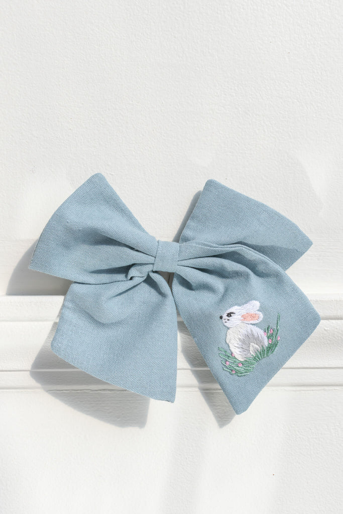 french girl hair accessories. a blue clip bow with a pretty bunny / rabbit embroidered detail. amantine