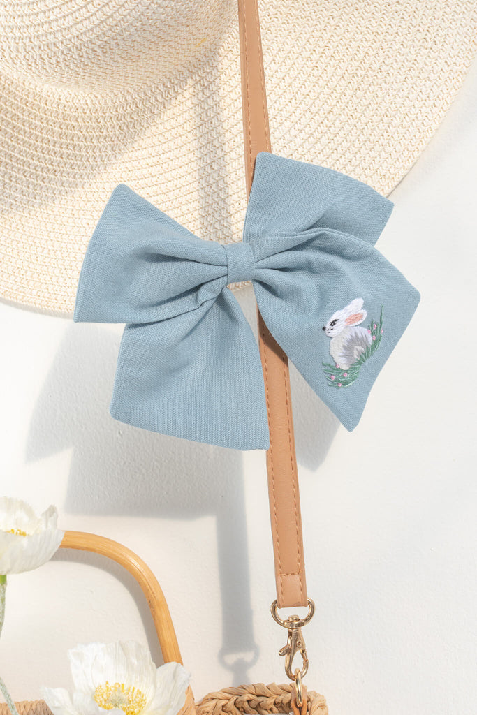 french girl hair accessories. a blue clip bow with a pretty bunny / rabbit embroidered detail. amantine