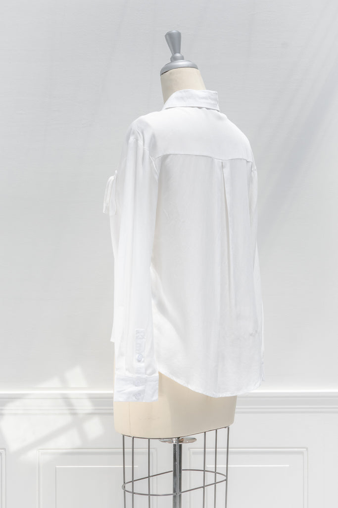 cute french style white button down shirt. side view.