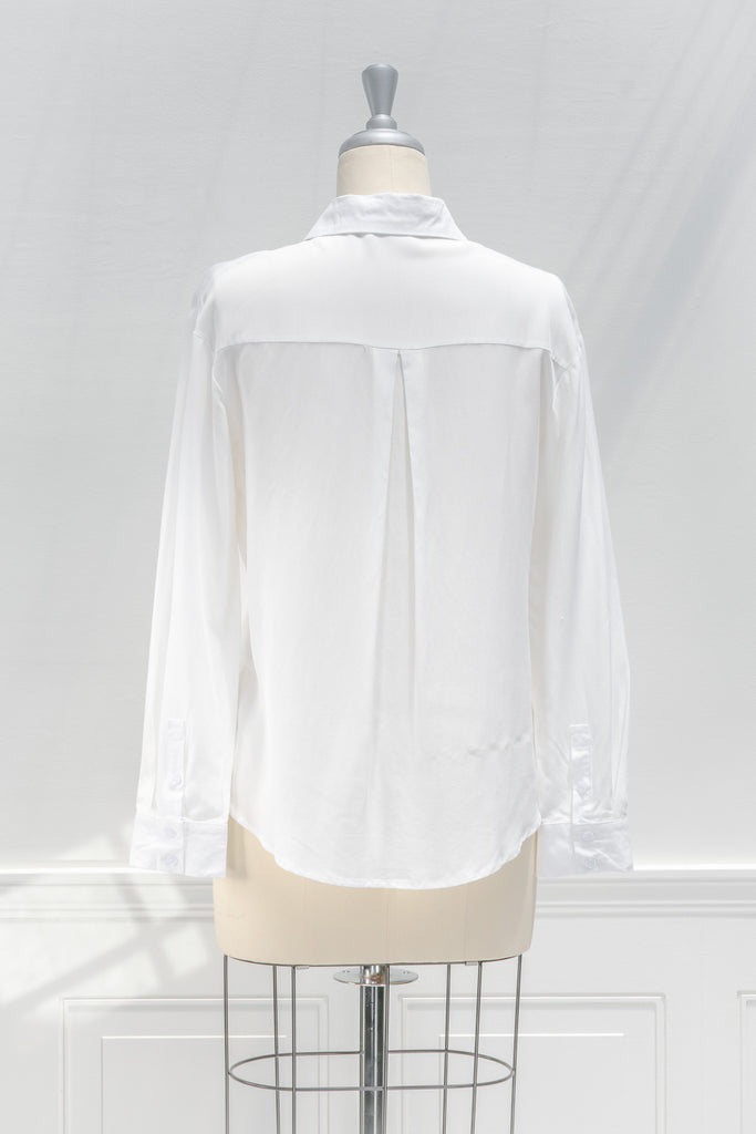 cute french style white button down shirt. back view.