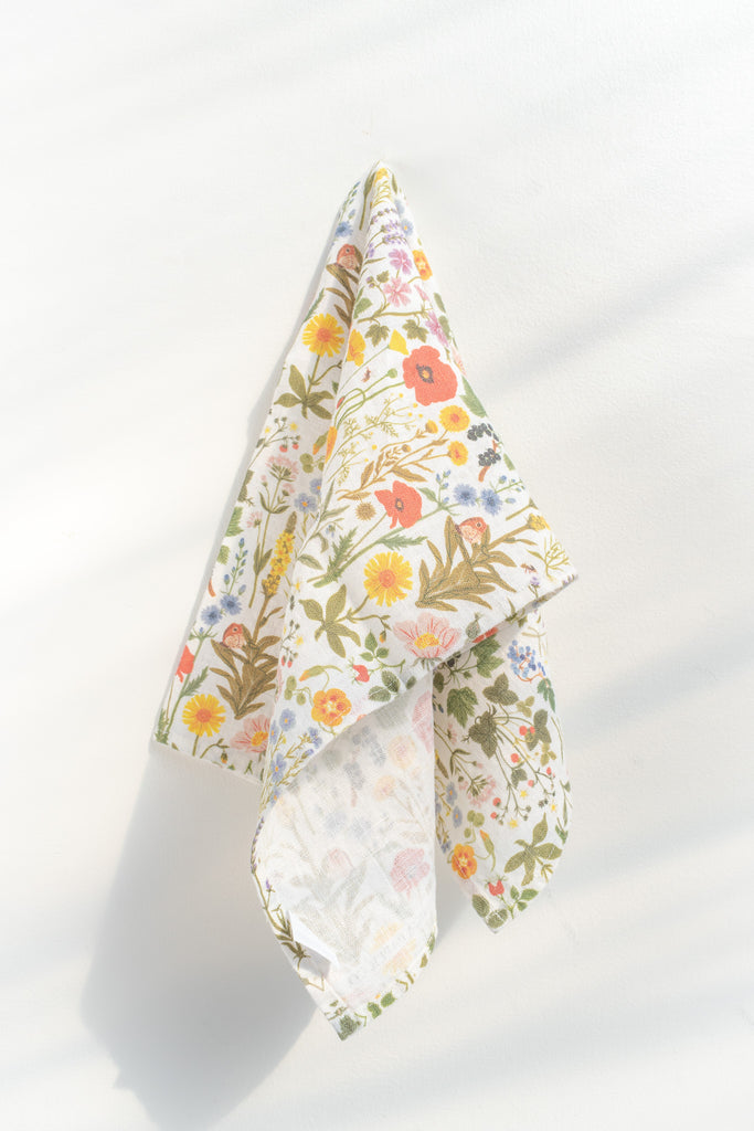 a french kitchen essential - a linen tea towel with a wild flower French cottage garden print motif. the perfect gift for the francophile in your life. 