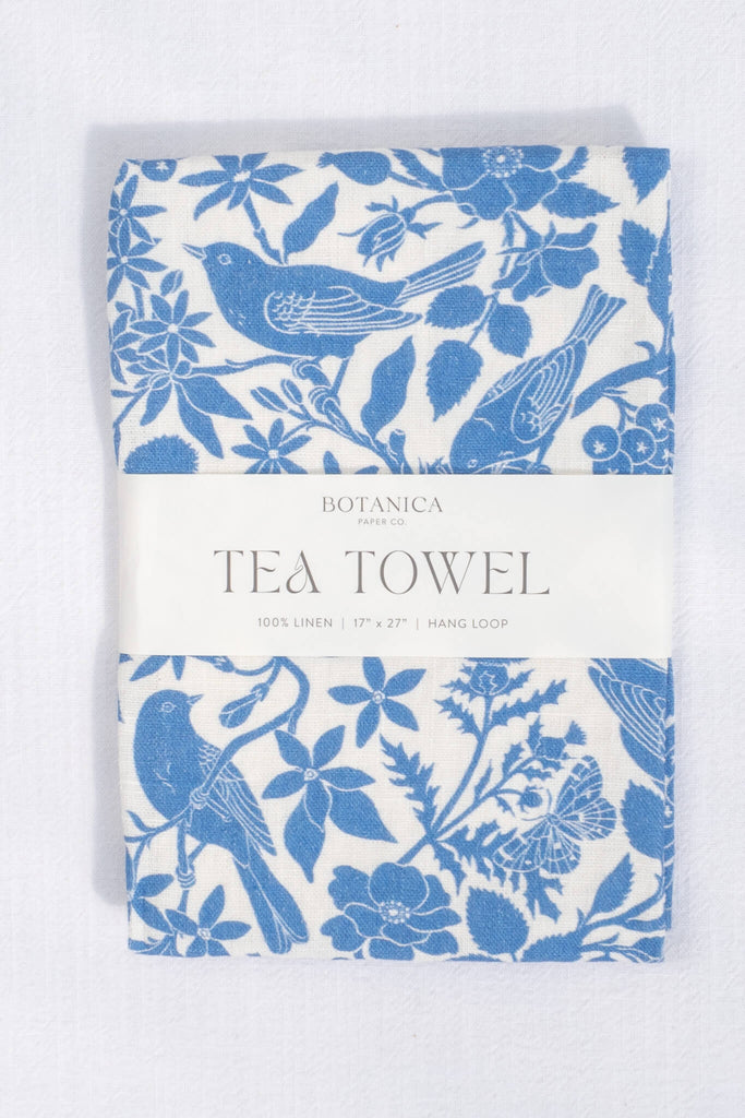 a french kitchen essential - a linen tea towel with a blue bird print motif. the perfect gift for the francophile in your life. 