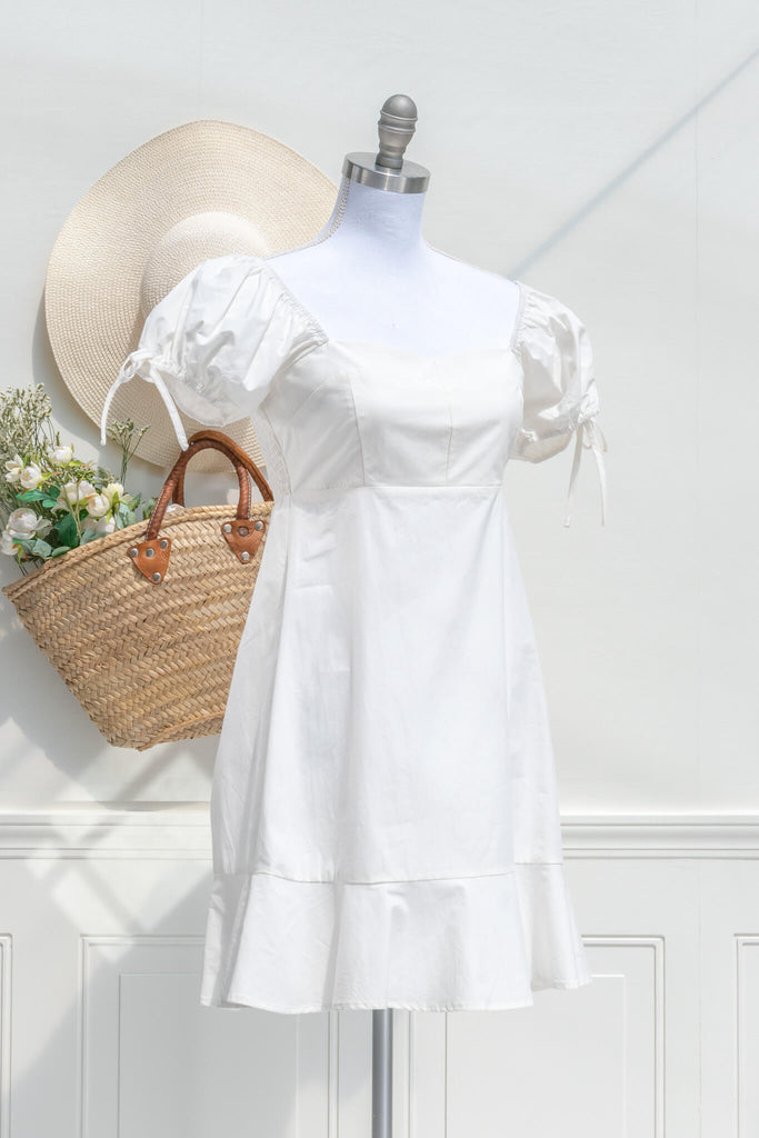 graduation dress - a lwd perfect for graduation, mini dress, puff sleeves, cottagecore style. front view. 