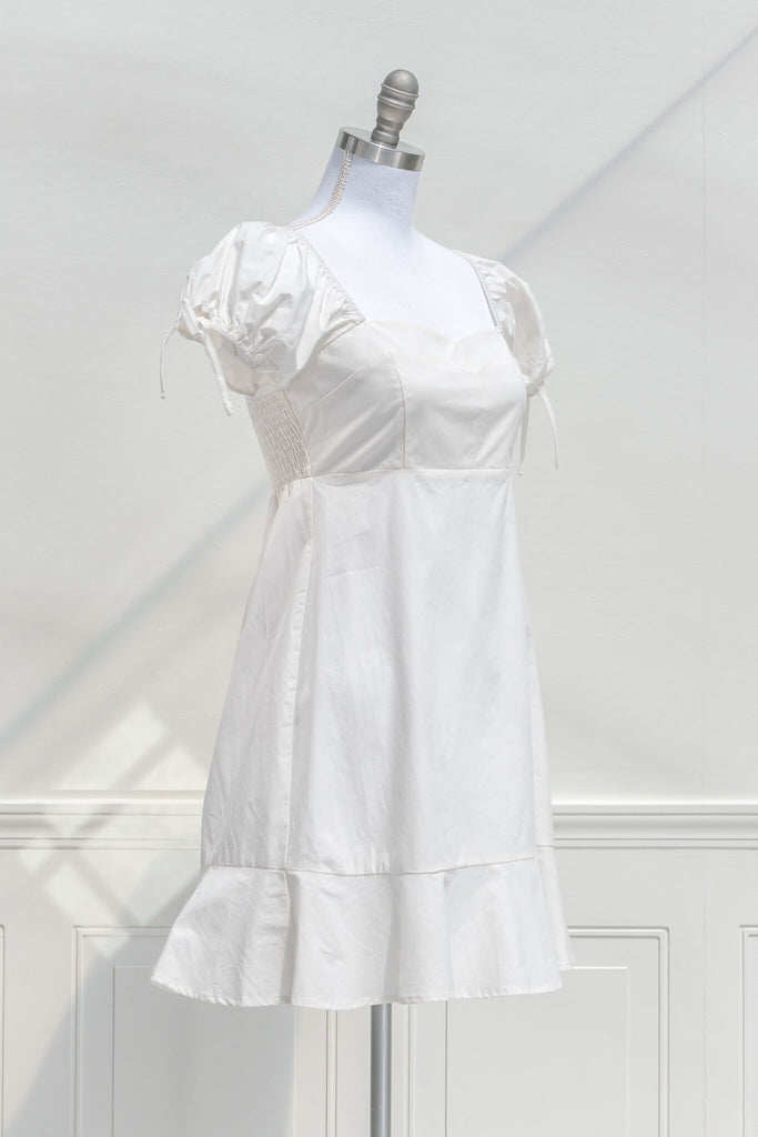 graduation dress - a lwd perfect for graduation, mini dress, puff sleeves, cottagecore style. quarter side view. 