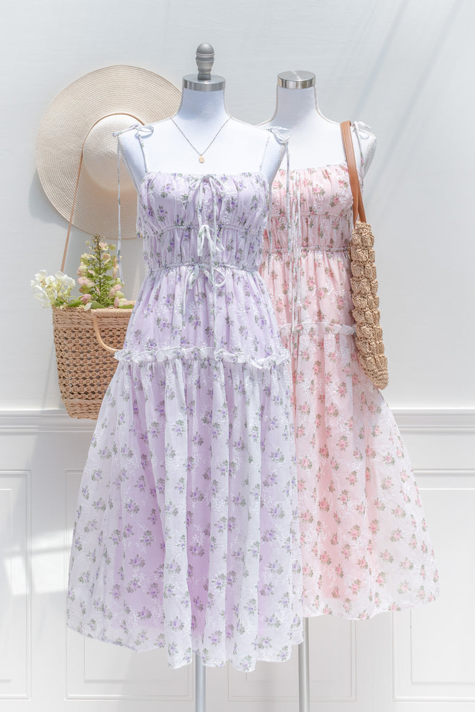 two ethereal summer midi dresses for women. one pink the other peach. 