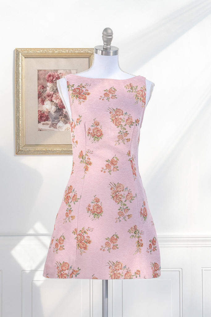 Here is an SEO-optimized alt text description for the dress:

pink cottagecore dress with delicate floral print featuring a classic boat neckline and flattering tailored fit perfect for feminine French style fashion. amantine boutique.