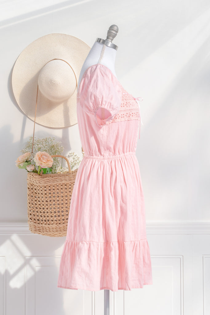 Lightweight pink dress with puff sleeves and gathered waist, offering an effortless, feminine silhouette.