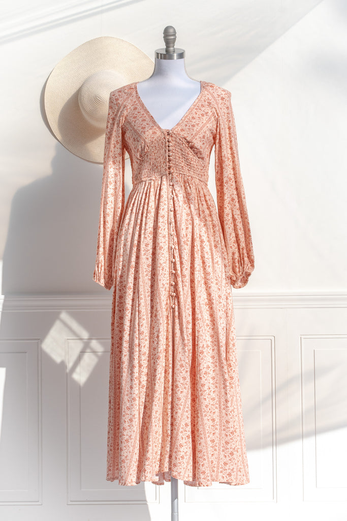 pretty dresses - an elegant modest dress with long sleeves, button front, and floral fabric. amantine dresses. front view. 