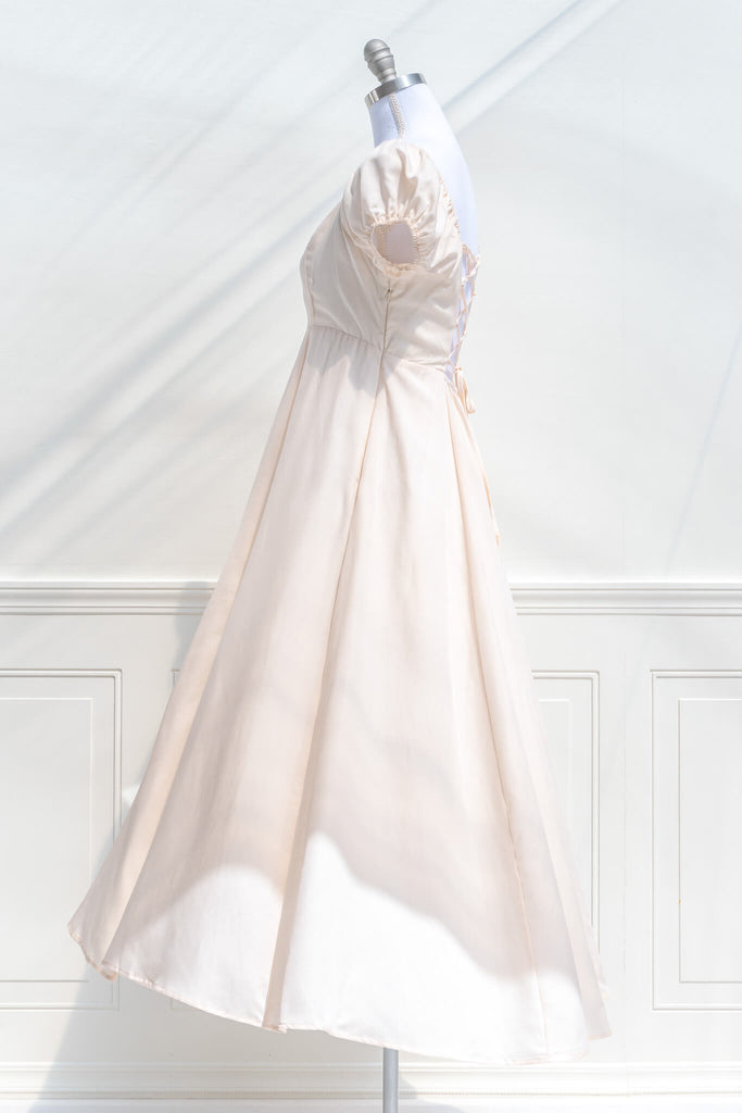 feminine cottagecore dress in cream color. side view. 