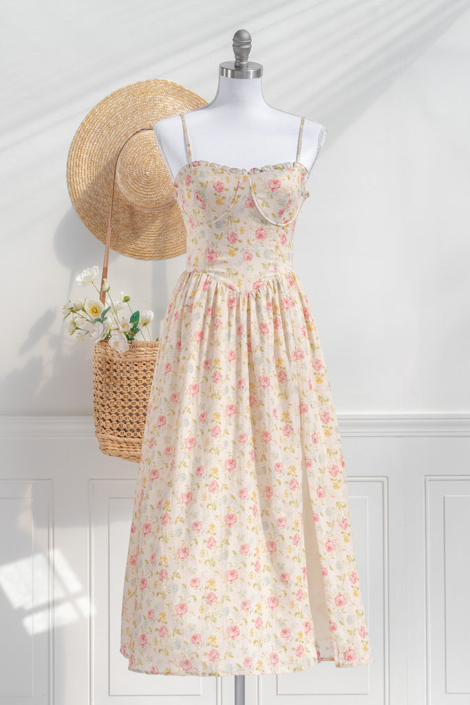 Romantic dresses - a beautiful floral cottagecore dress with structured bodice, pretty florals, on a cream fabric. perfect for the park, or to stroll. cottagecore romantic dress. front view. 