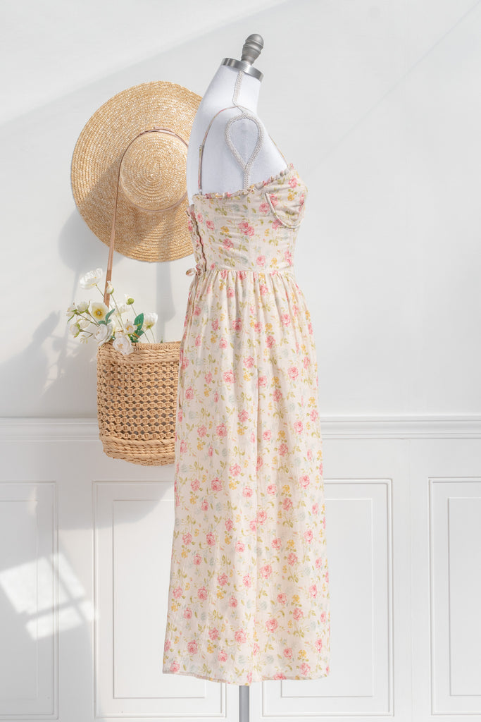 Romantic dresses - a beautiful floral cottagecore dress with structured bodice, pretty florals, on a cream fabric. perfect for the park, or to stroll. cottagecore romantic dress. side view. 