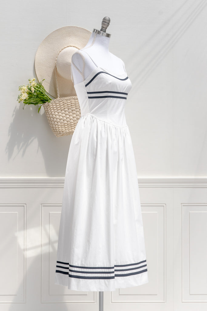 the white lotus season 3 piper ratliff's dress - a white dress with blue stripes on bust and hem. side view. 