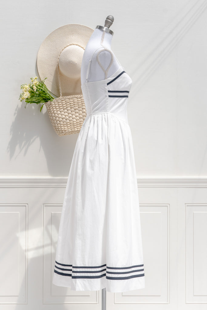 the white lotus season 3 piper ratliff's dress - a white dress with blue stripes on bust and hem. side view. 