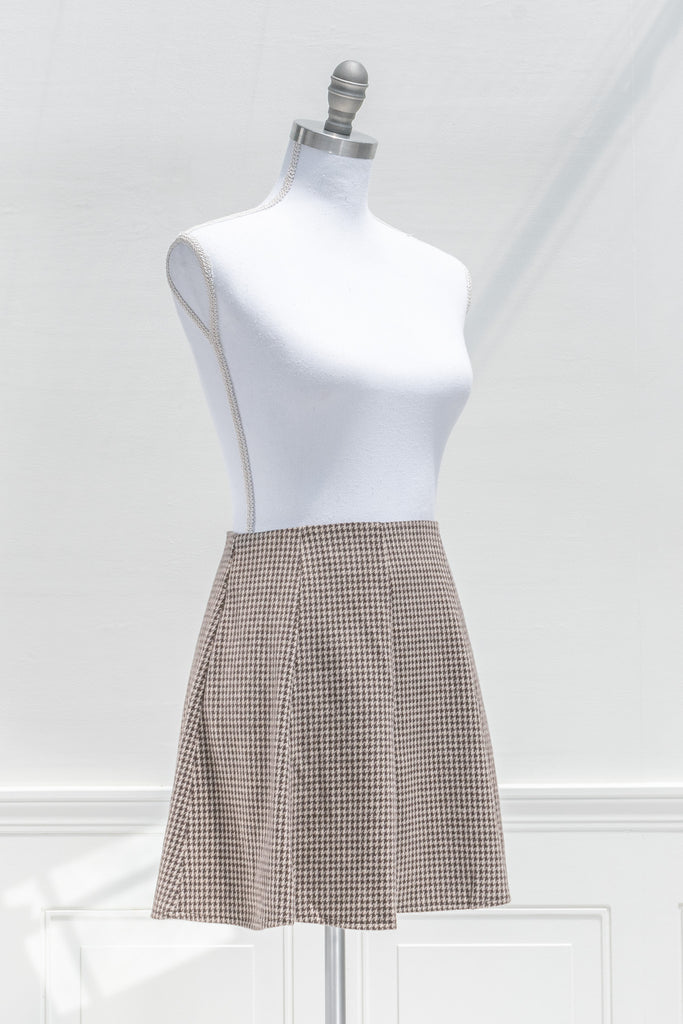 a cute brown plaid mini box pleated skirt. side view. 