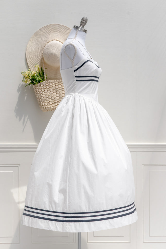 the white lotus season 3 piper ratliff's dress - a white dress with blue stripes on bust and hem. front view. 