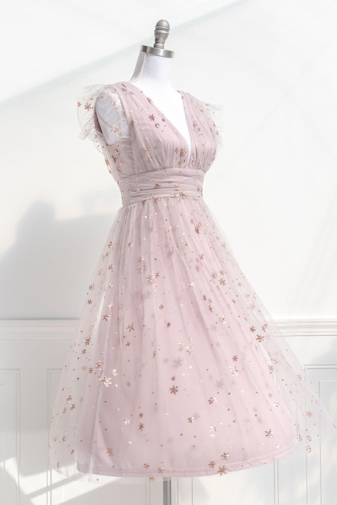 vintage inspired pink aesthetic dress in a french inspired and romantic style - has v neckline and no sleeves, pink tulle with star motif - amantine boutique 