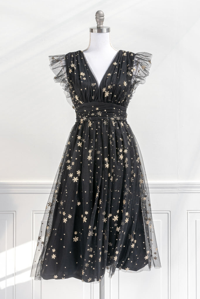 vintage inspired black and gold retro dress in a french inspired and romantic style - has v neckline and no sleeves, delicate tulle with gold star motif - amantine boutique 
