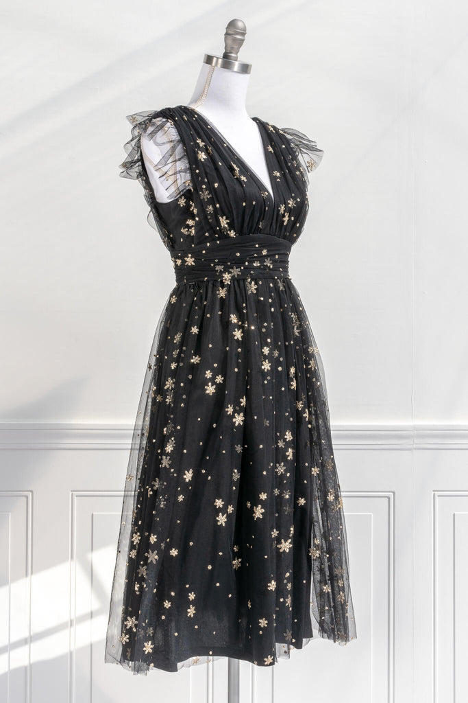 vintage inspired black and gold retro dress in a french inspired and romantic style - has v neckline and no sleeves, delicate tulle with gold star motif - amantine boutique 