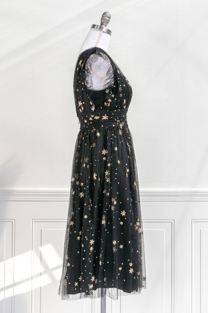 vintage inspired black and gold retro dress in a french inspired and romantic style - has v neckline and no sleeves, delicate tulle with gold star motif - amantine boutique 