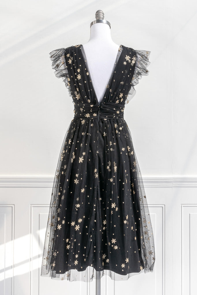 vintage inspired black and gold retro dress in a french inspired and romantic style - has v neckline and no sleeves, delicate tulle with gold star motif - amantine boutique 