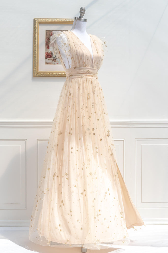 feminine event dress from amantine boutique - light cream color dress with star glitter motif