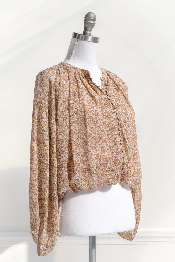 feminine clothing - amantine - a modest, long-sleeve, button up, caramel blouse - amantine - quarter view