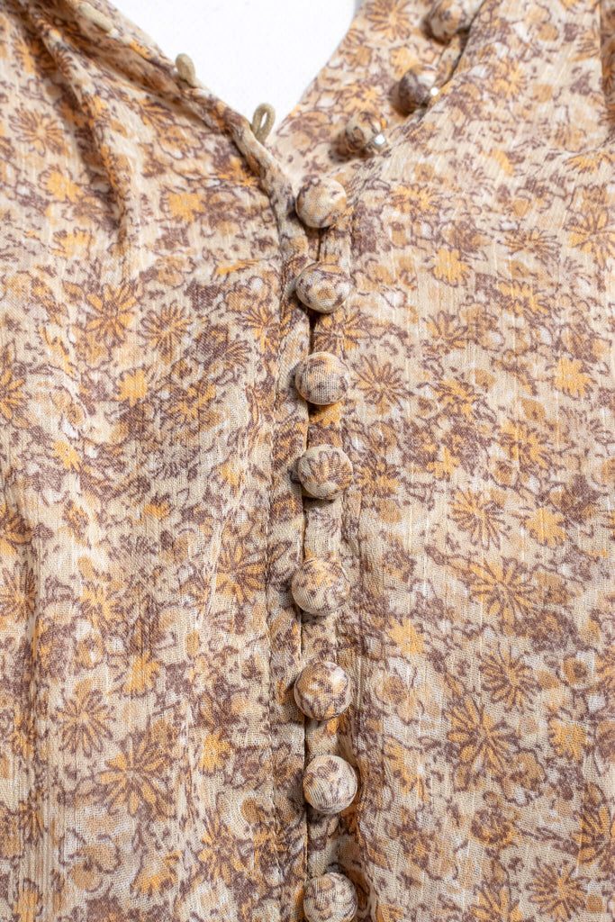 feminine clothing - amantine - a modest, long-sleeve, button up, caramel blouse - amantine - fabric detail view