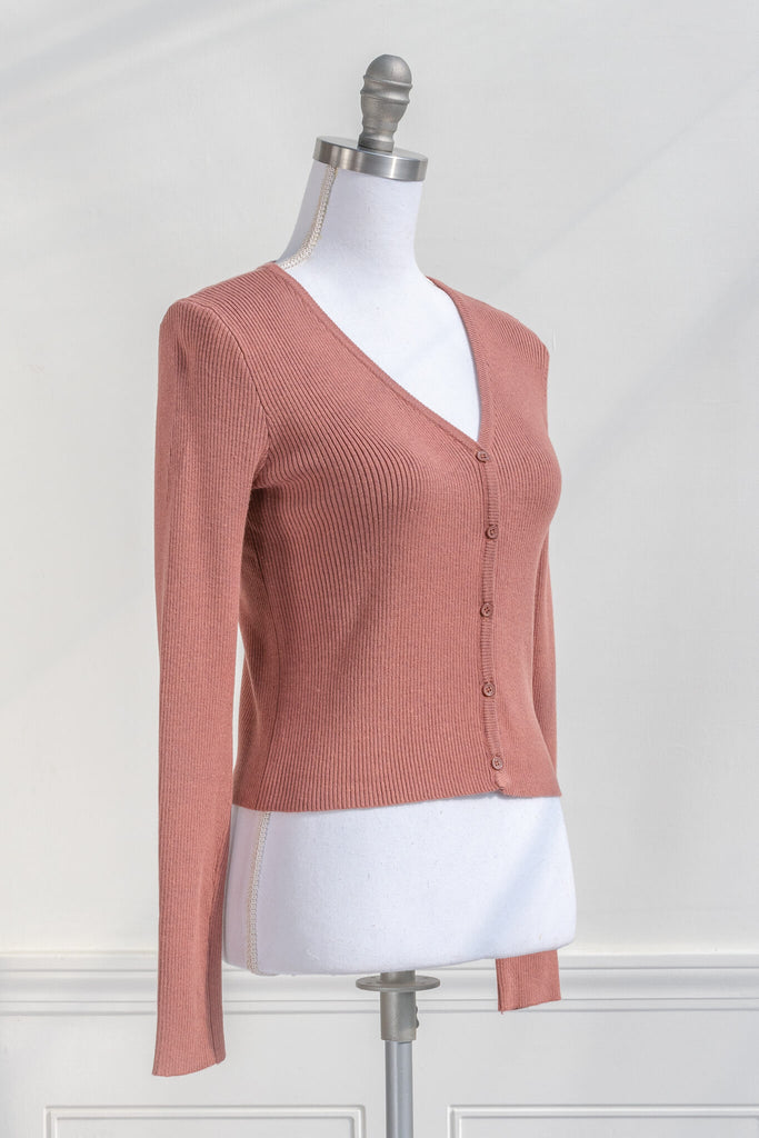 feminine dresses and sweaters - a coral colored cardigan button down from Amantine quarter view