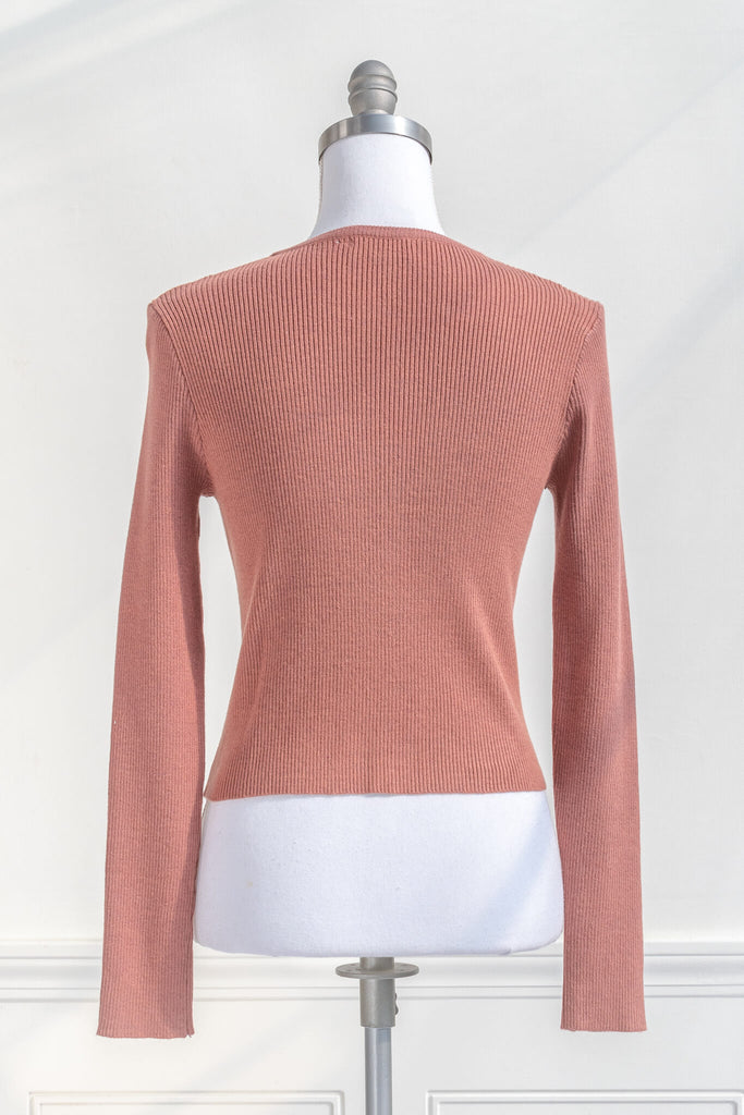 feminine dresses and sweaters - a coral colored cardigan button down from Amantine  back view