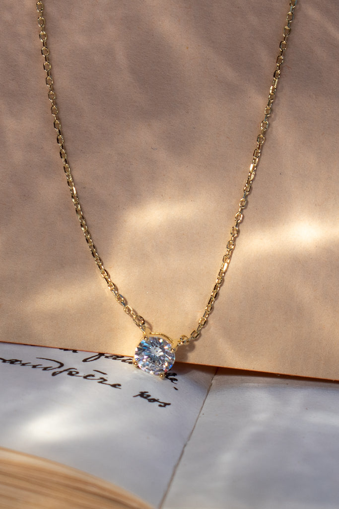 feminine french inspired minimalist diamond solitaire necklace