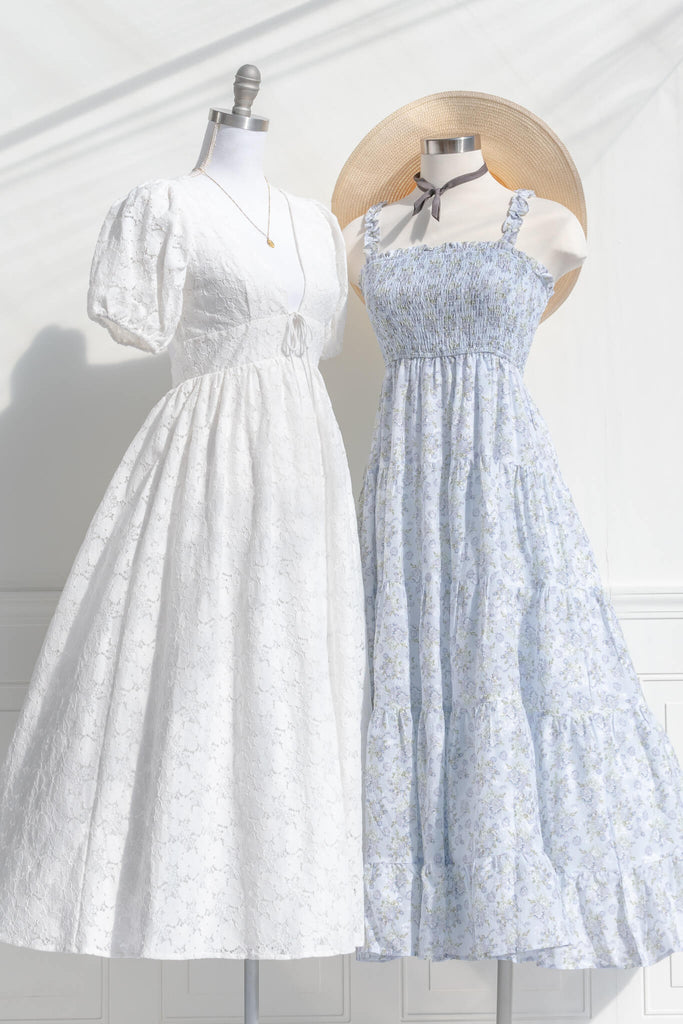 Feminine Clothing and Romantic Dresses - A white lace, v neck, 3/4 sleeve, full skirt white dress - Amantine French and Vintage Inspired Dresses With a Blue Dress next to it. 