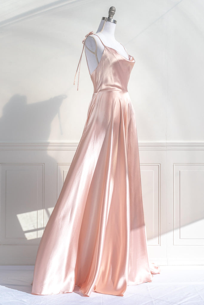 vintage style prom dress - a peach fuzz satin prom gown with a cowl neckline and straps. fitted bodice and full bride style skirt - amantine french aesthetic dresses - quarter view