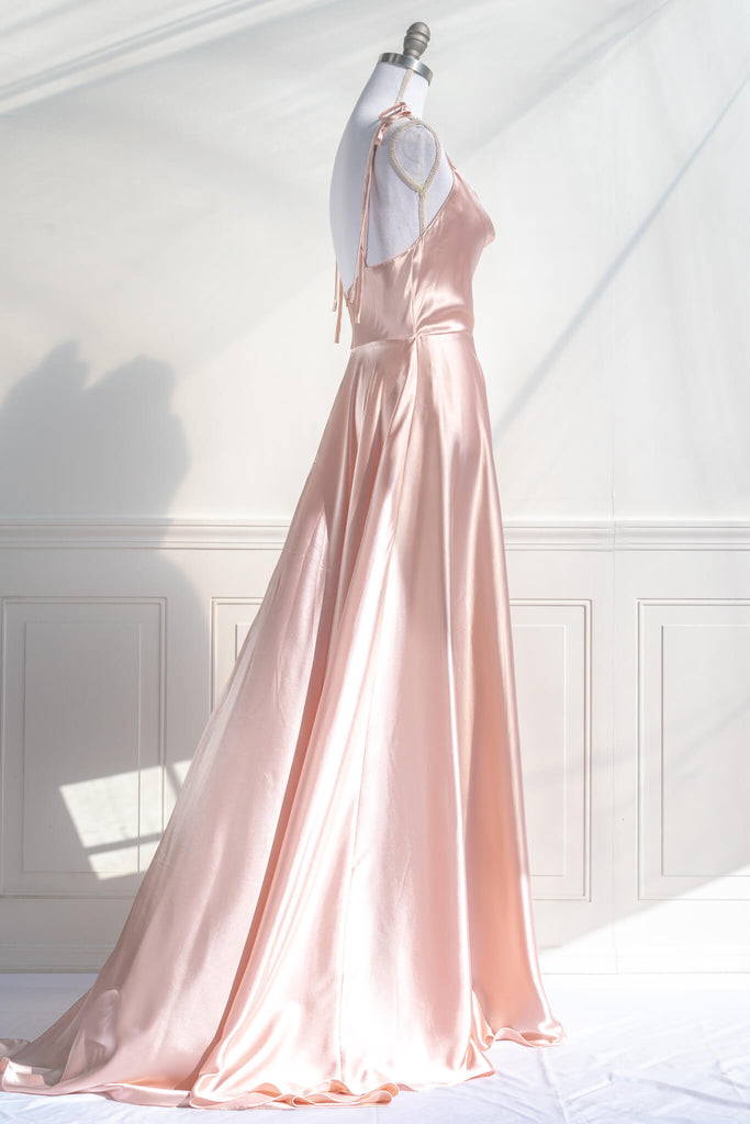 vintage style prom dress - a peach fuzz satin prom gown with a cowl neckline and straps. fitted bodice and full bride style skirt - amantine french aesthetic dresses - side view 2